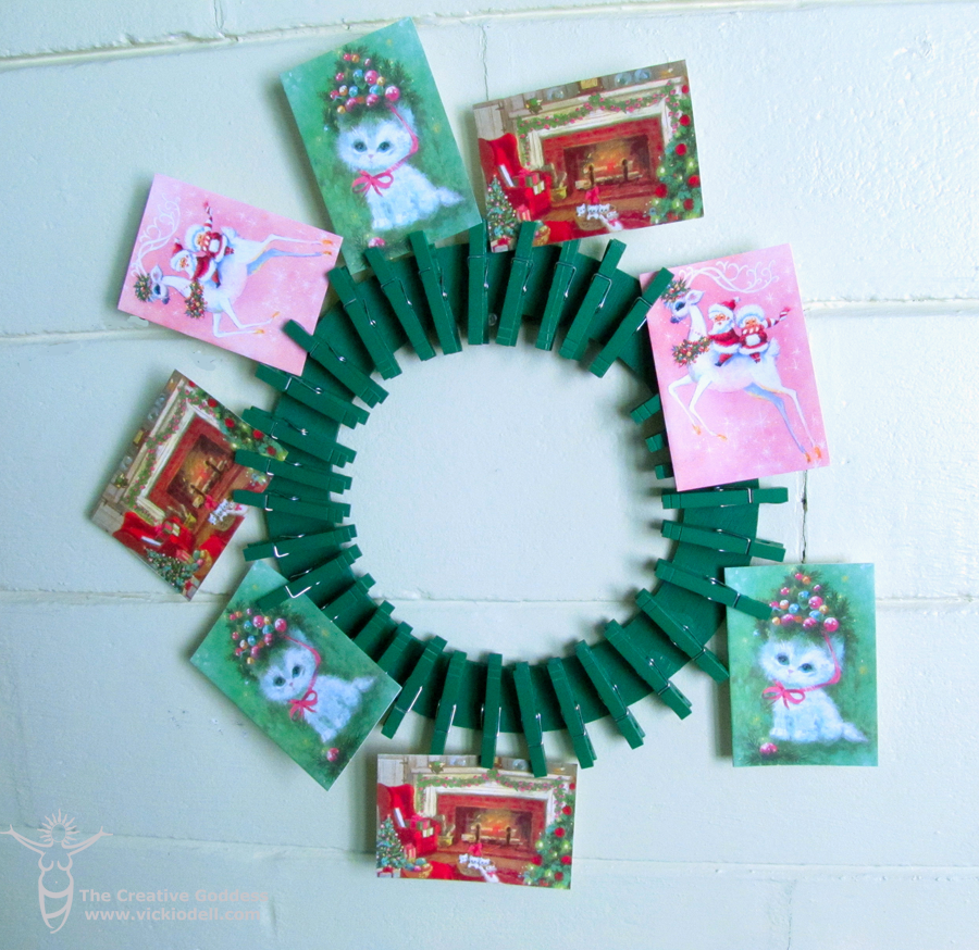 Christmas card display wreath using Krylon, and clothespins
